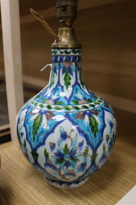 A Chinese wucai garlic-mouthed vase, late 17th century, restored, hole to base and an Isnik style baluster vase, possibly Kutahya (both